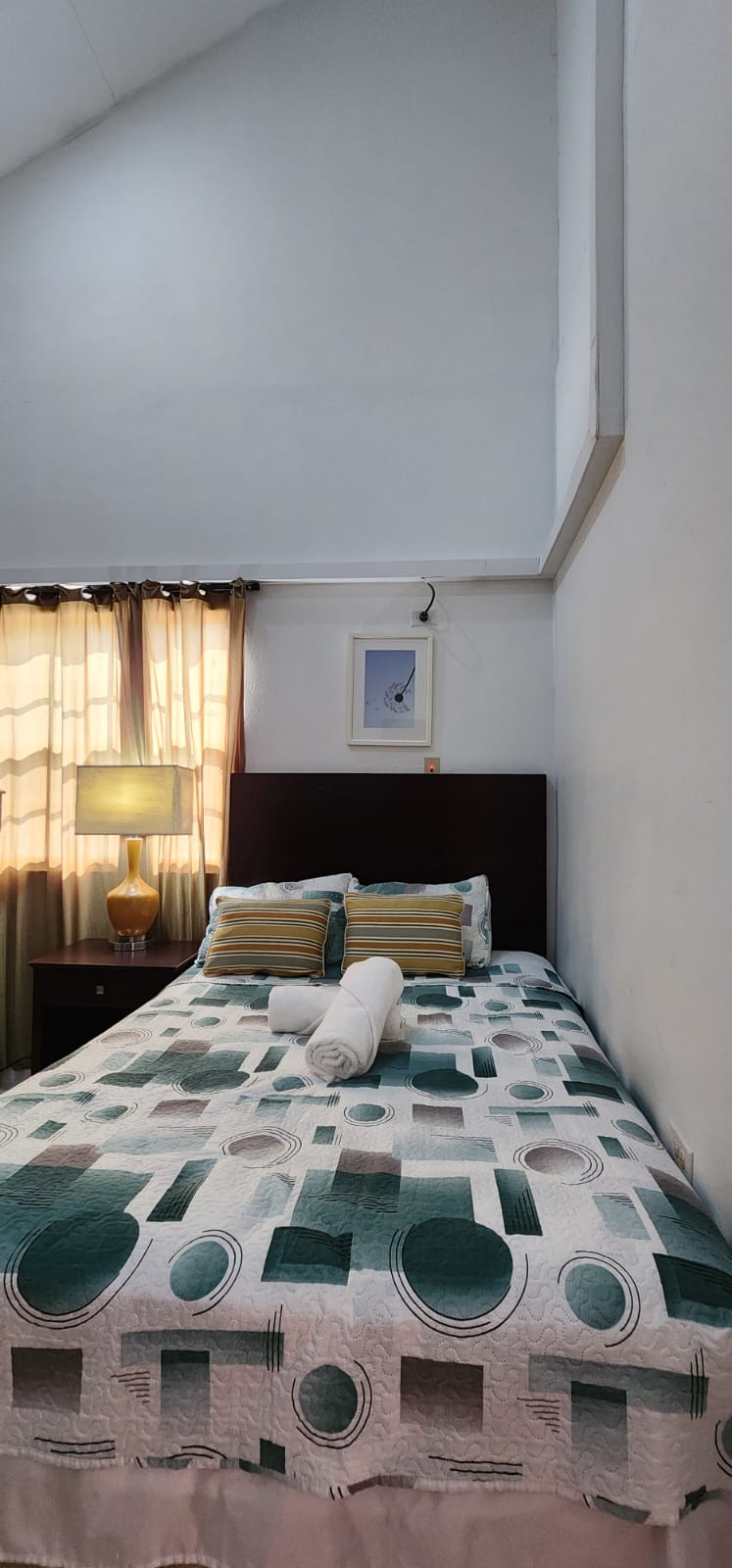 One-bedroom apartment bedroom with queen bed